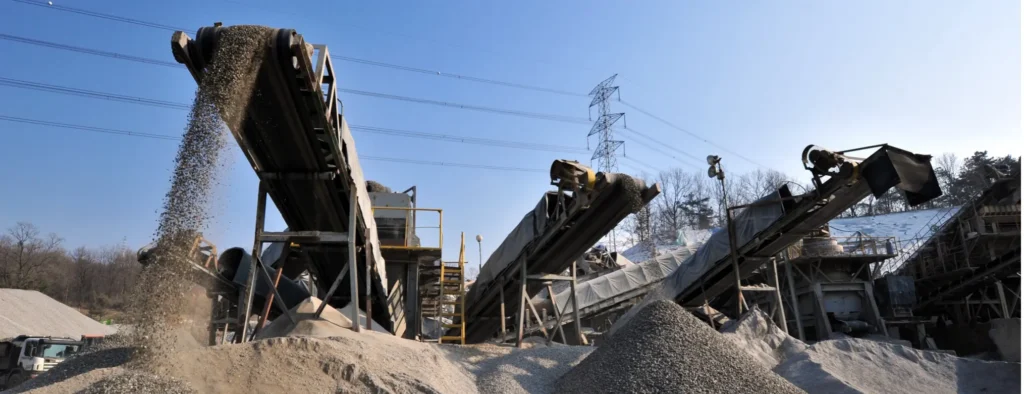 View of aggregate conveyors transferring materials at a plant.